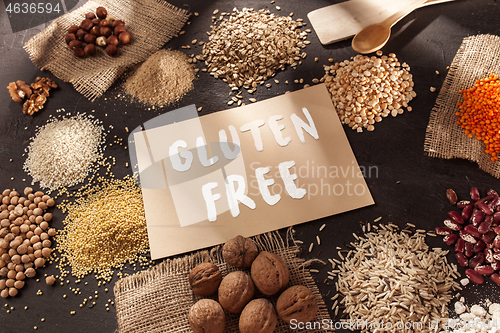 Image of Gluten free flour and cereals millet, quinoa, corn bread, brown buckwheat, rice with text gluten free