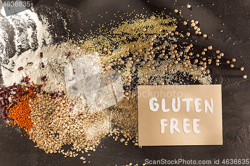 Image of Gluten free flour and cereals millet, quinoa, corn bread, brown buckwheat, rice with text gluten free