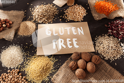 Image of Gluten free flour and cereals millet, quinoa, corn bread, brown buckwheat, rice with text gluten free