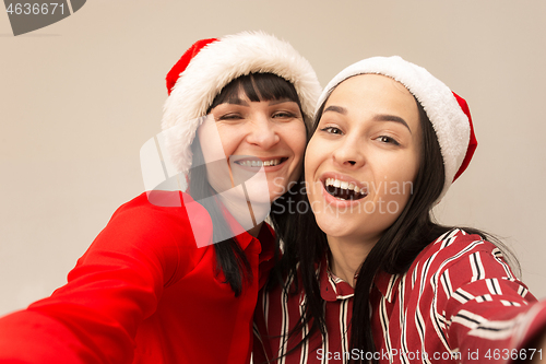 Image of A portrait of a happy mother and daughter