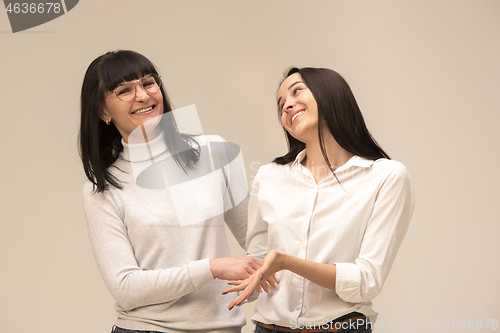 Image of A portrait of a happy mother and daughter