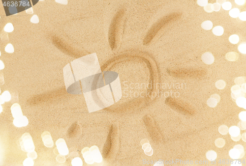 Image of picture of sun in sand on summer beach