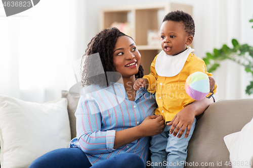 Image of mother and baby with ball at home