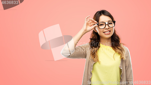 Image of happy asian woman in glasses or student