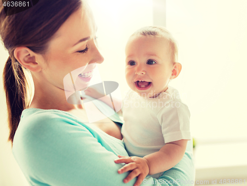 Image of happy young mother with little baby at home