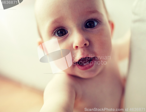 Image of close up of happy little baby boy or girl at home