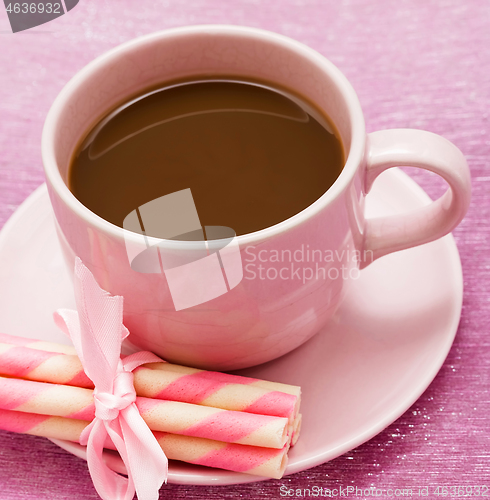 Image of Mug of freshly brewed coffee and some strawberry cookie sticks 