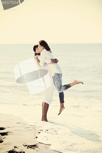 Image of happy young couple have fun at beautiful beach