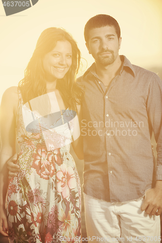 Image of happy young couple have romantic time on beach