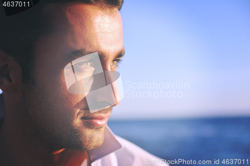 Image of young man at beach