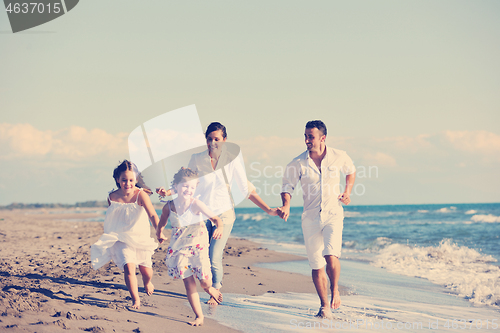 Image of happy young  family have fun on beach