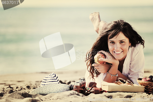 Image of happy young woman on beach