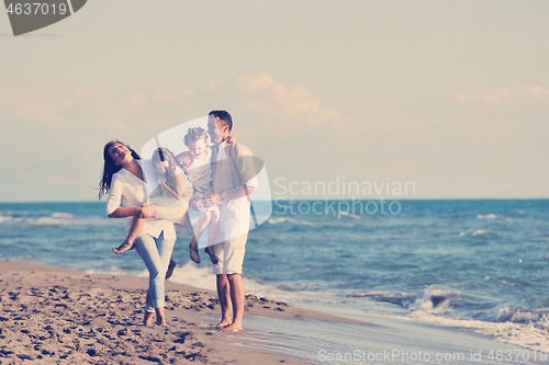 Image of happy young  family have fun on beach