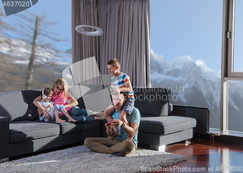 Image of Happy family playing a video game