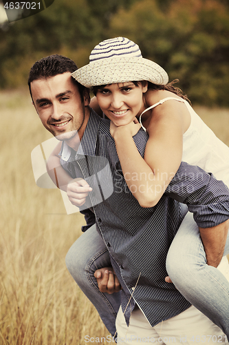 Image of happy young couple have romantic time outdoor