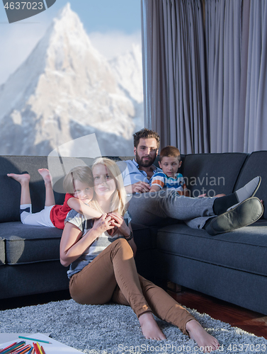 Image of young couple spending time with kids