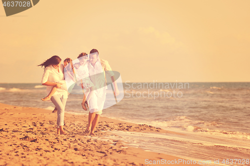 Image of happy young  family have fun on beach