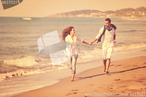 Image of happy young couple have fun at beautiful beach