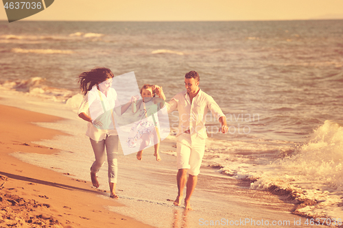 Image of happy young  family have fun on beach