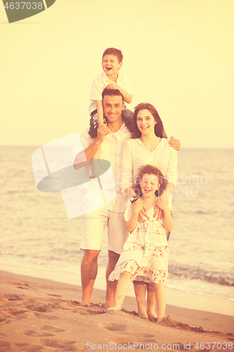 Image of happy young family have fun on beach