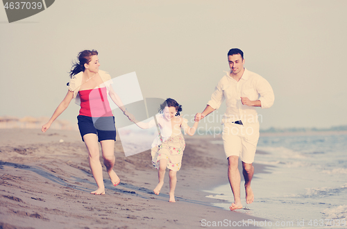 Image of happy young family have fun on beach