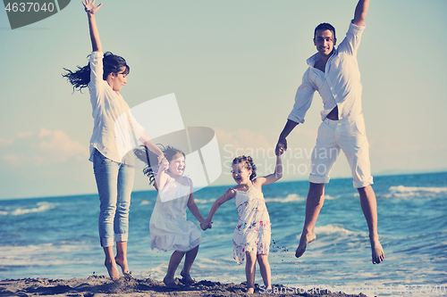 Image of happy young  family have fun on beach