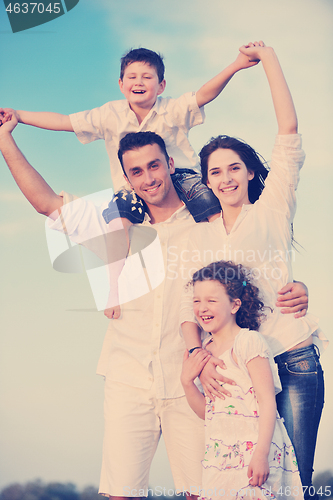 Image of happy young family have fun on beach