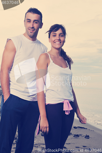 Image of happy young couple have fun at beautiful beach