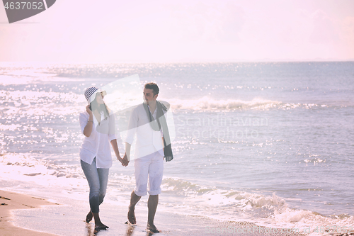 Image of happy young couple have fun at beautiful beach