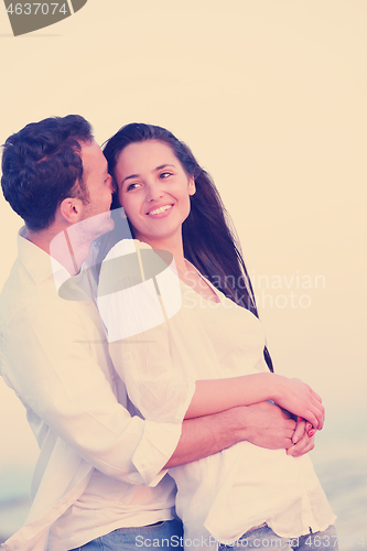 Image of young couple  on beach have fun