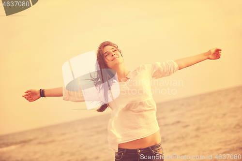 Image of young woman enjoy on beach