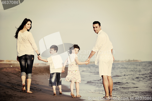 Image of happy young family have fun on beach
