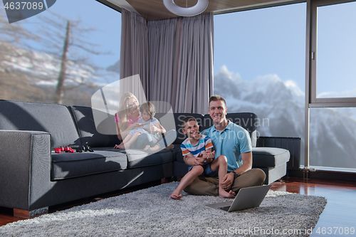 Image of Happy family playing a video game