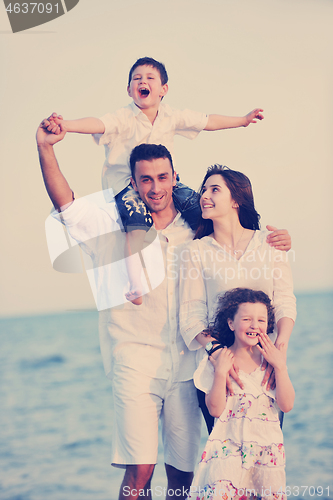 Image of happy young family have fun on beach