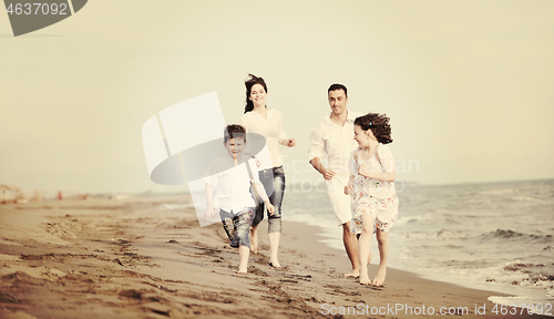 Image of happy young family have fun on beach