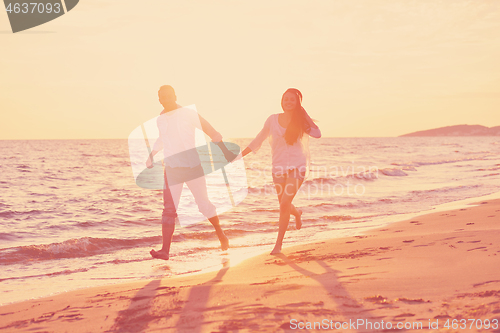 Image of young couple  on beach have fun