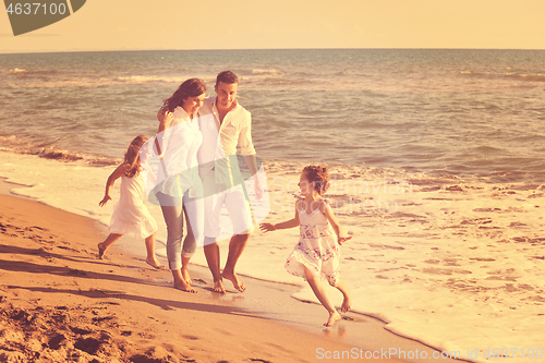 Image of happy young  family have fun on beach