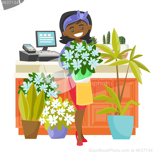 Image of Business owner holding a bouquet in a flower shop.