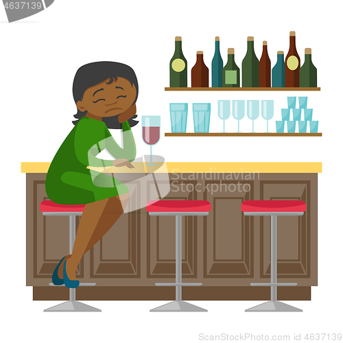 Image of Sad african-american woman drinking wine in a bar.