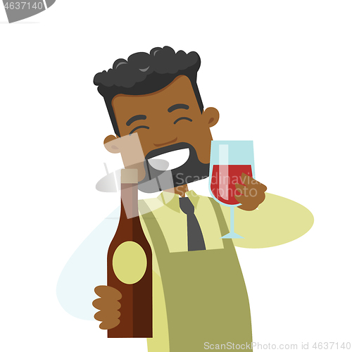 Image of African waiter holding glass and bottle of wine.