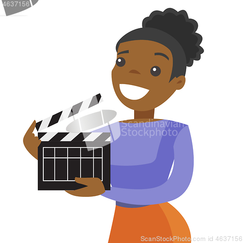 Image of Young african woman holding a movie clapper board.