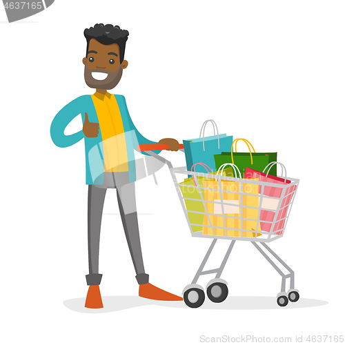 Image of Young african-american man with shopping bags.