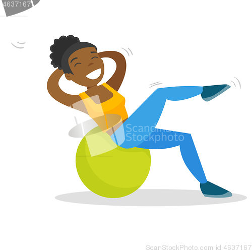 Image of African-american woman exercising with fitball.
