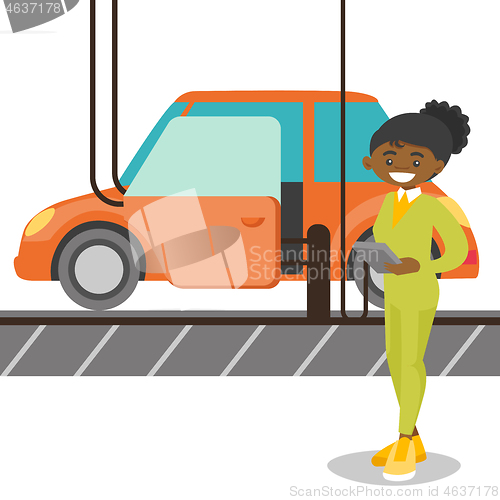 Image of Worker controlling automated assembly line for car