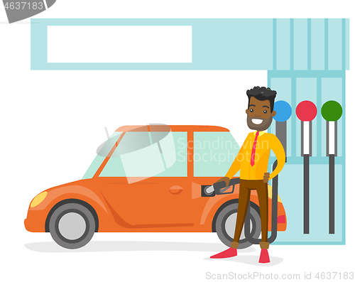 Image of Man filling up fuel into the car at a gas station.