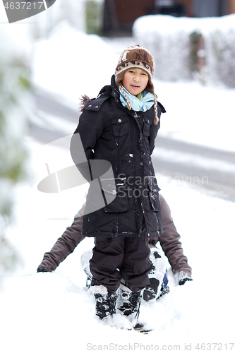 Image of Girl playing in the snow in winter in denmark