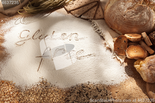 Image of Gluten free food. Various pasta, bread and snacks on wooden background from top view