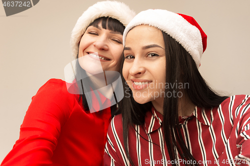 Image of A portrait of a happy mother and daughter