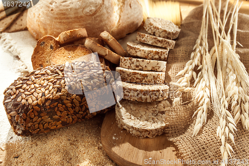 Image of Gluten free food. Various pasta, bread and snacks on wooden background from top view