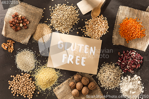 Image of Gluten free flour and cereals millet, quinoa, corn bread, brown buckwheat, rice with text gluten free